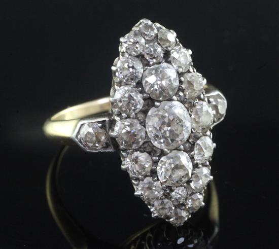 An early 20th century Georgian style gold and old cut diamond set oval dress ring, size P.
